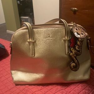 Gold Kate spade purse.
